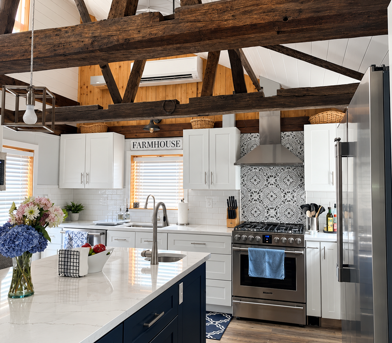 White and navy shaker cabinetry. Quartz countertops.