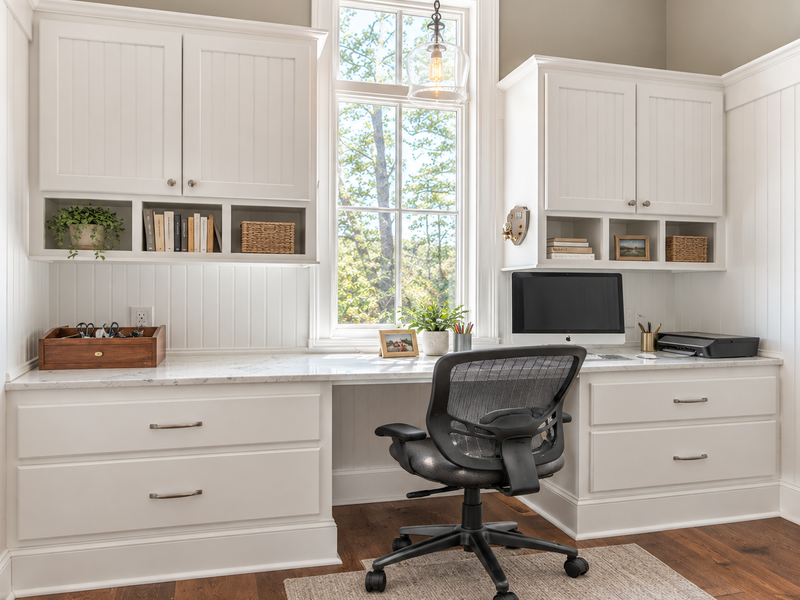 Open-concept game room with custom built-in cabinetry