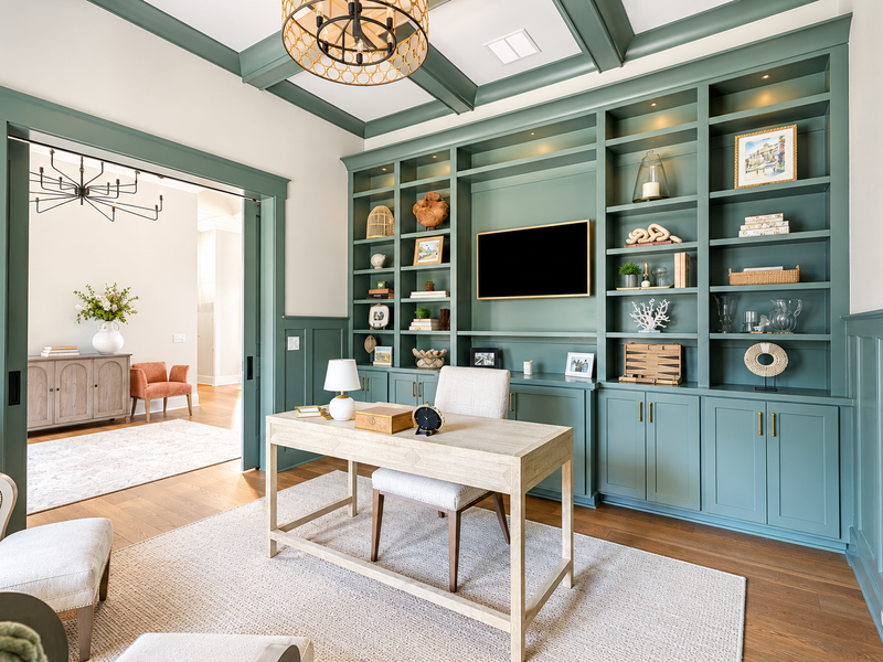 Home office with custom built-in desk and shelving